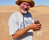 Photo of Al Muth, PhD Holding Lizards at Boyd Desert Center for Research